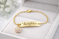 
              Personalized Gold Name Plate Bracelet with Crystal Flower Charm
            