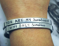 
              You are my sunshine,  my only sunshine Set of 2 bracelets - Custom bangle bracelets  - Hand Stamped Cuff Bangles - Hypoallergenic Bracelets
            