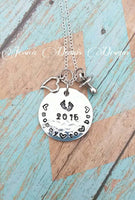 
              Mommy to be Necklace hand stamped with year baby is expected - Heart - Pacifier - Texturized - Baby Feet
            